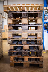 a stack of euro pallets in a workshop