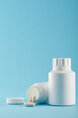 Blank medicine bottle on blue background