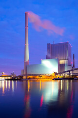 Illuminated coal power plant causing global warming and climate change