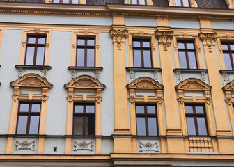 facade of an building, facade of a elegant old building, Street view of an old, elegant residential building facade in Paris, with ornate details in the stone walls