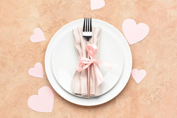 Beautiful table setting for Valentine's Day on beige background