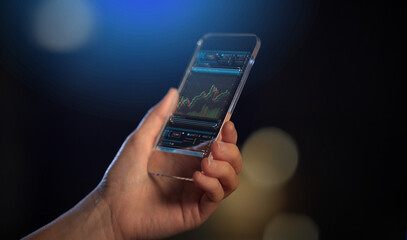 business, finances and technology concept - close up of hand with forex chart on transparent smartphone screen