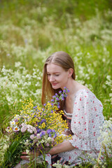 Naklejka na ściany i meble Medieval lady in historical dress. Aroma of spring nature, wild flowers, blue sky, sunshine.