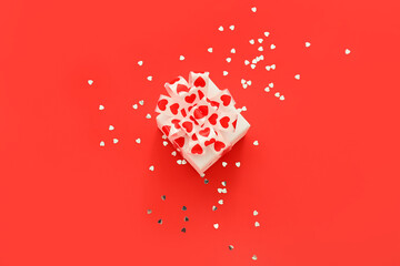 Beautiful gift box on red background. St. Valentine's Day