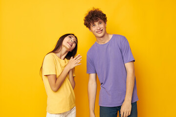Fototapeta premium portrait of a man and a woman Friendship posing fun studio yellow background unaltered