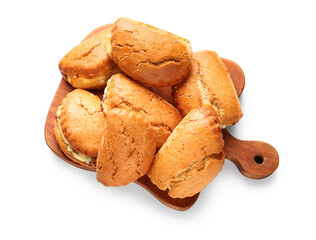 Wooden board of tasty sochniki with cottage cheese on white background