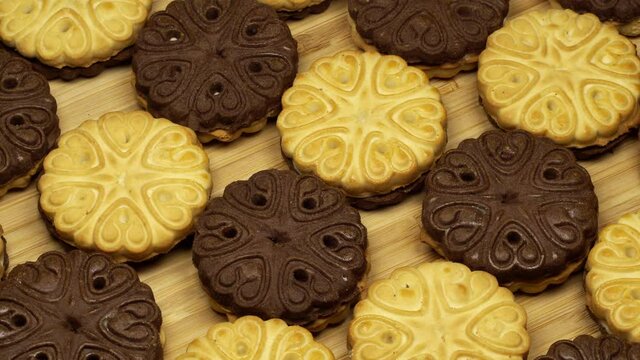 Sweet milk and chocolate cookies rotation background. Close up