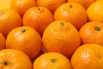 Many ripe tangerines as background, closeup