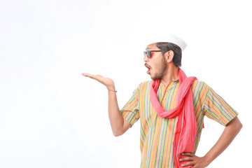 Young indian farmer in traditional wear and giving expression on white background.