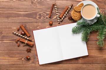 Opened book with blank pages, cup of coffee, cookies and winter decor on wooden background