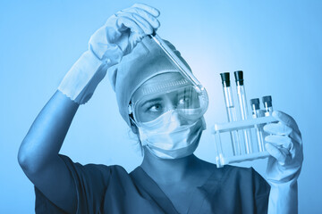 Young chemist student working in lab on chemicals