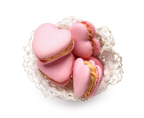 Bowl with tasty heart-shaped macaroons on white background