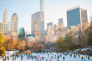 Ice skaters having fun in New York Central Park in winter - 481340716