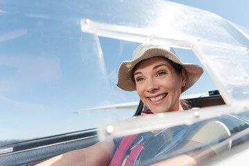 an excited woman in a glider