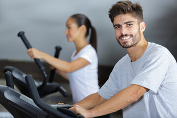 Fototapeta na wymiar people running in machine treadmill at fitness gym club