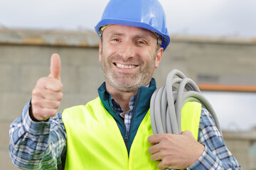 happy electrician showing thumbs up