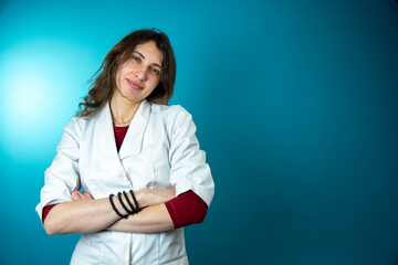 Female caucasian doctor dressed in uniform isolated on background. Smiling Caucasian medical doctor thinking.