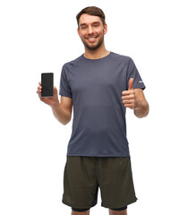 fitness, sport and healthy lifestyle concept - smiling man in sports clothes showing smartphone and thumbs up gesture over white background