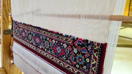 Oriental carpet in the loom