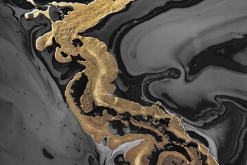 Fluid Art. Metallic gold and gray abstract waves. Marble effect background or texture