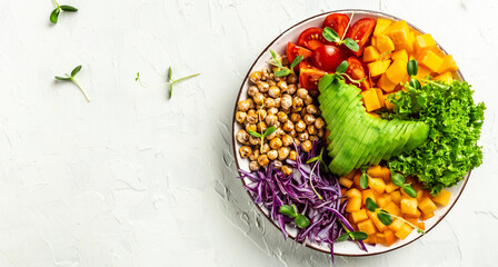 vegan, detox Buddha bowl with avocado, tomato, red cabbage, chickpea, fresh lettuce salad, pumpkin,...