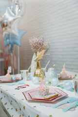 
The festive table is beautifully served to receive guests. An example of decorating a table for a birthday or anniversary celebration. Wedding table. Nutcracker style table