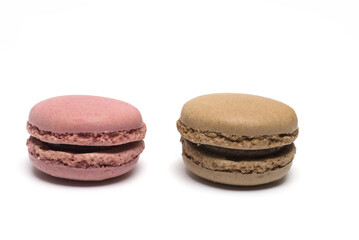 Closeup two different colored macaron white background