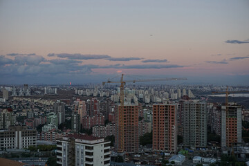 Obraz premium skyscraper, constructions and crane in istanbul Başakşehir, sunset
