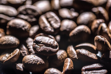 Freshly roasted coffee beans background. Coffee beans macro, texture.