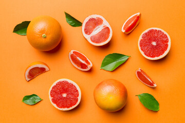 fresh Fruit grapefruit with Juicy grapefruit slices on colored background. Top view. Copy Space. creative summer concept. Half of citrus in minimal flat lay with copy space