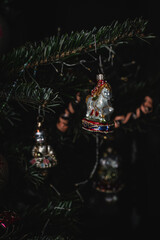 Vintage Christmas glass ornaments on fresh spruce tree.