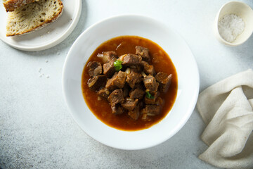 Traditional homemade beef goulash served with bread