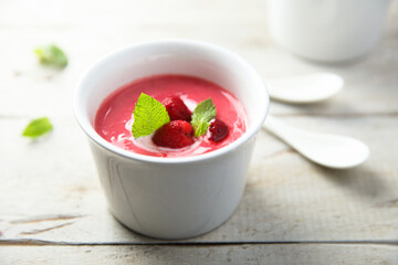 Refreshing cold raspberry soup with fresh mint
