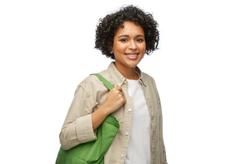 eco living, zero waste and sustainability concept - portrait of happy smiling woman with green reusable canvas bag for food shopping over white background - Powered by Adobe