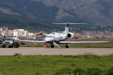 Fototapeta na wymiar Preparing aircraft for departure in high altitude airport 
