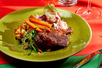 Fried chicken tapaka or tabaka with potatoes and sweet potato. Bright backgrounds. Hard shadows, selective focus.