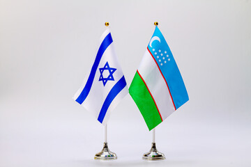 State flags of Israel and Uzbekistan on a light background. Flags of states.