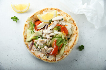 Fresh Greek pita bread with chicken and vegetables
