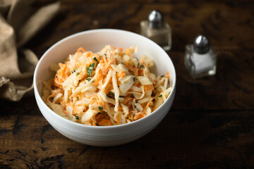 Traditional homemade coleslaw salad with fresh parsley