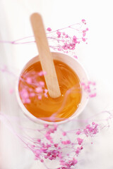 
Sugaring paste. Beautiful background . Sugaring paste on a background of flowers