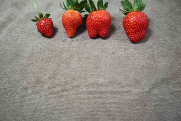 fresh strawberries on the gray background design for healthy food and organic concept
