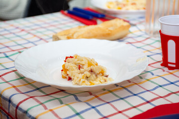 plate of rice with gorgonzola onions and peppers on table