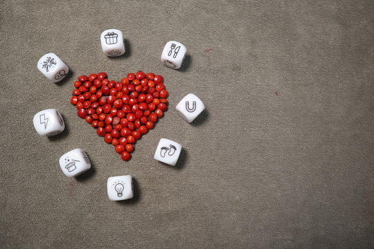 red heart and many picture dice design for love story and thinking