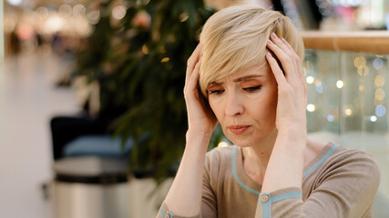 Sad middle aged caucasian woman 40s lady feel depressed problems. Upset mature single female difficult thinking headache migraine divorce solitude trouble. 50 year old wife suffer from mental disorder