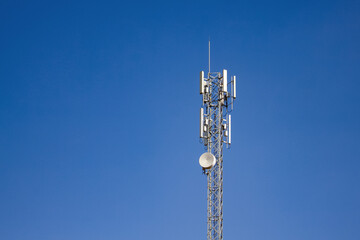 upward of Communication Radio antenna Tower, microwave antenna tower on blue sky background