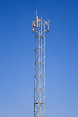 upward of Communication Radio antenna Tower, microwave antenna tower on blue sky background
