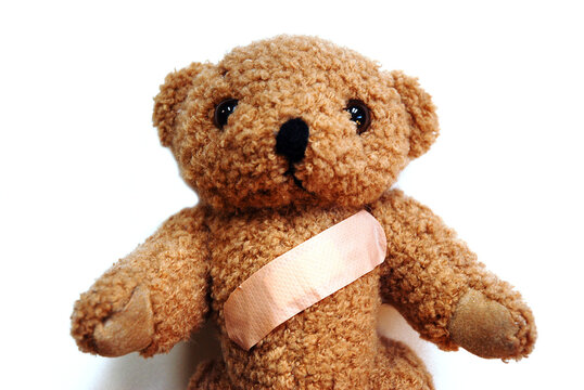 Teddy bear with a plaster