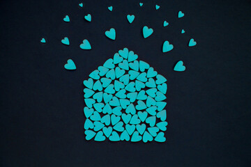 Many blue hearts in the form of house. House full of love concept