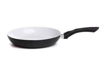 a large dark-colored kitchen pan with a black handle with a white non-stick coating on an isolated background, side view