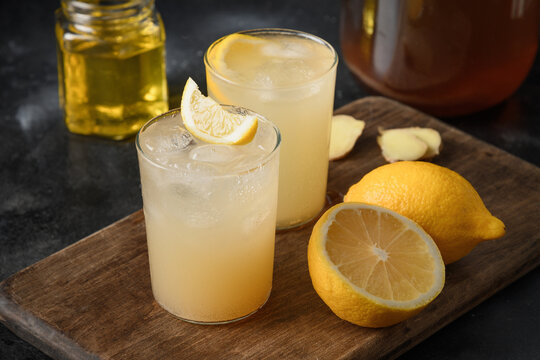 Kombucha drink made from tea mushroom in a glass jar. Transparent glasses with a yeast drink. Organic probiotic beverage. Close up.